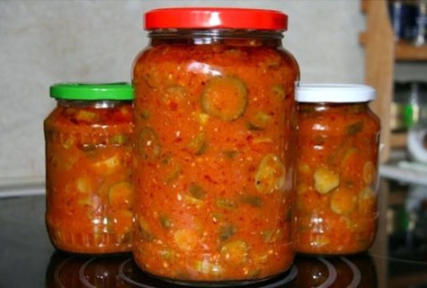 cucumber lecho in jars on the table