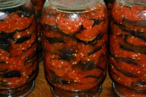 Greek eggplants in jars on the table