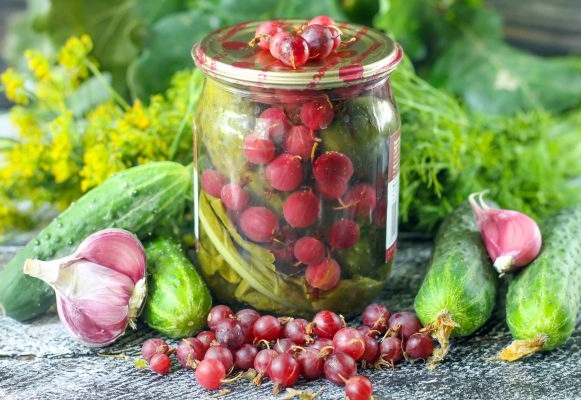 jars of cucumbers and gooseberries