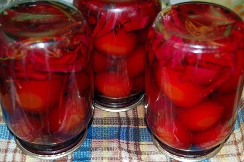 inverted cans of tomatoes and beets