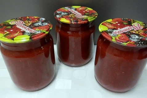 ketchup from plums in jars on the table