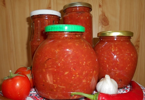 adjika with horseradish in jars on the table