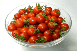 Description de la variété de tomate cerise rouge, ses caractéristiques et sa productivité