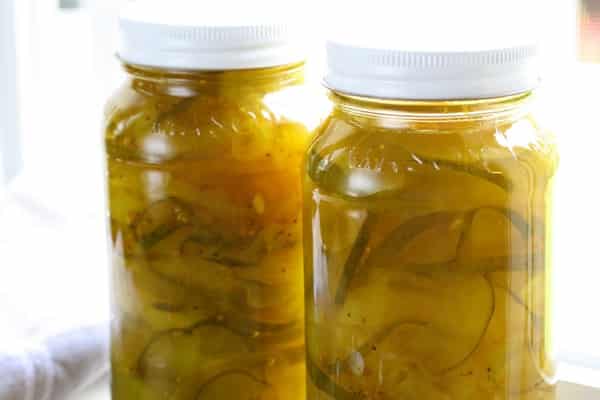 chopped cucumbers in a jar