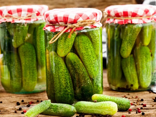 cucumbers with garlic in jars