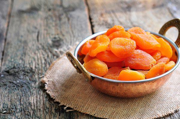 a bowl of dried apricots