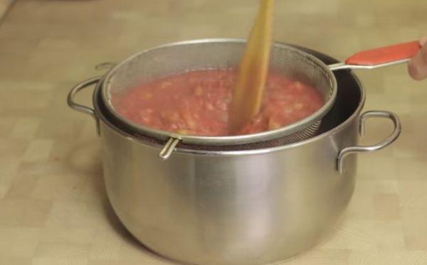 straining gooseberries